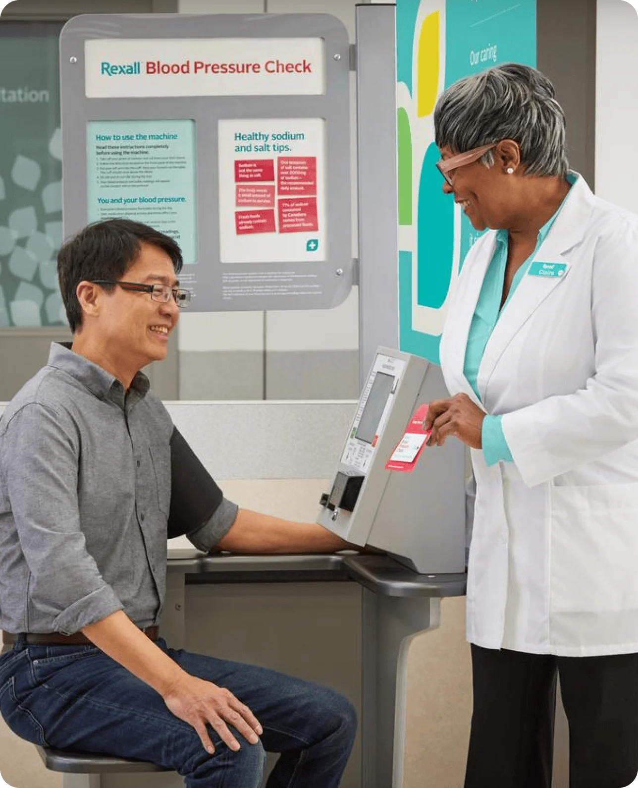 Rexall pharmacist helping a customer interpret blood pressure readings